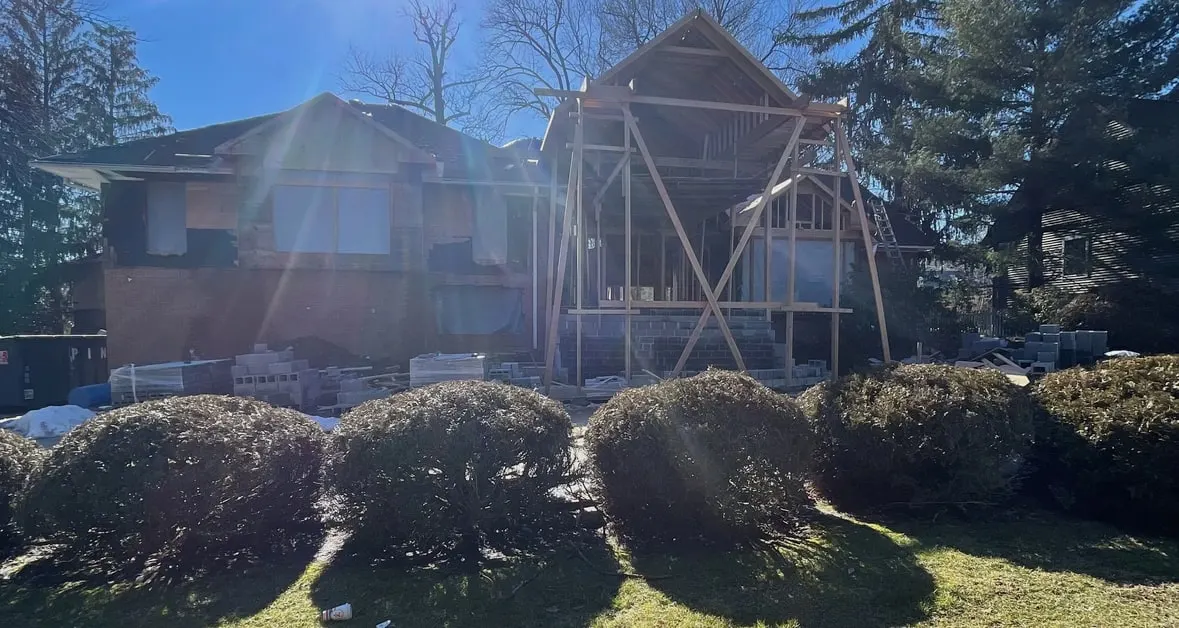 New Jersey home during an addition, with new framing rising behind the original house
